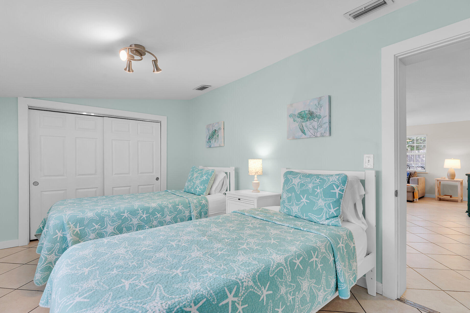 1707 George Street Key West, FL 33040 - Photo 19 of 39 a spacious bedroom with a bed and a lamp