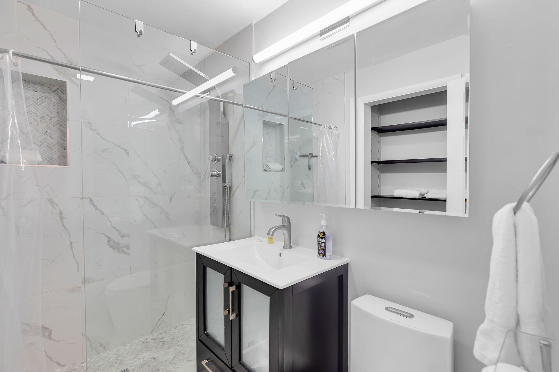 1707 George Street Key West, FL 33040 - Photo 21 of 39 a bathroom with a sink a toilet and a mirror