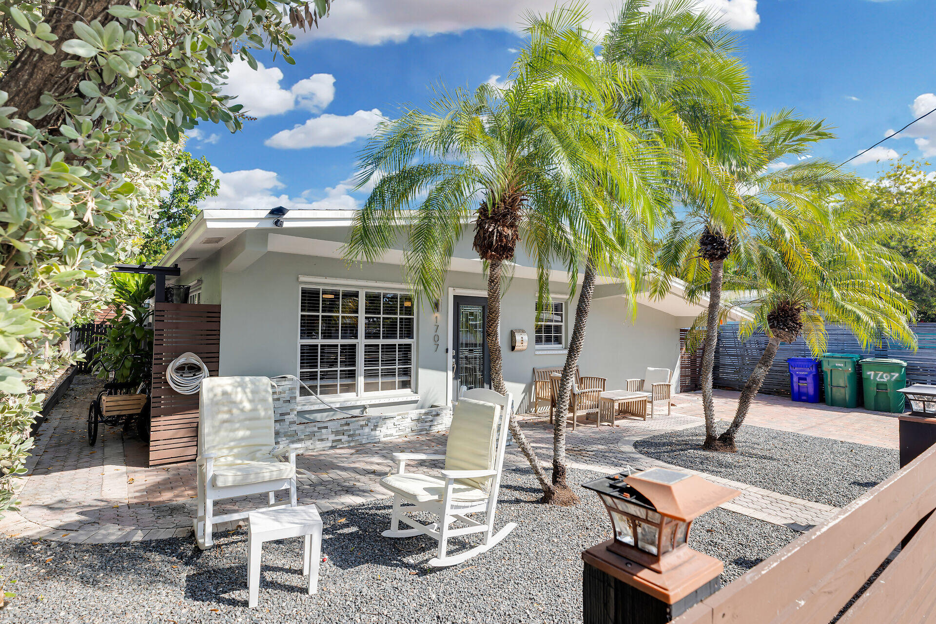 1707 George Street Key West, FL 33040 - Photo 36 of 39 a view of a patio with table and chairs and potted plants