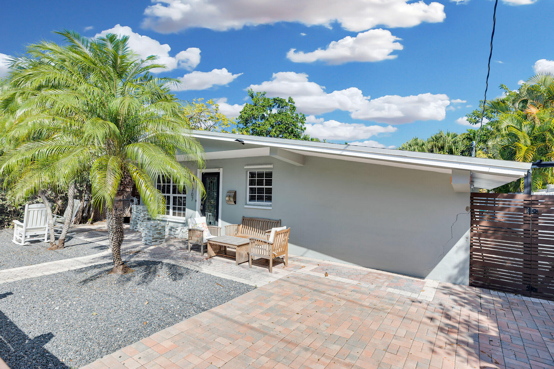 1707 George Street Key West, FL 33040 - Photo 37 of 39 a backyard of a house with table and chairs