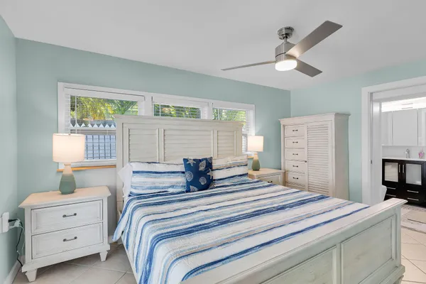 a bedroom with a bed and a dresser