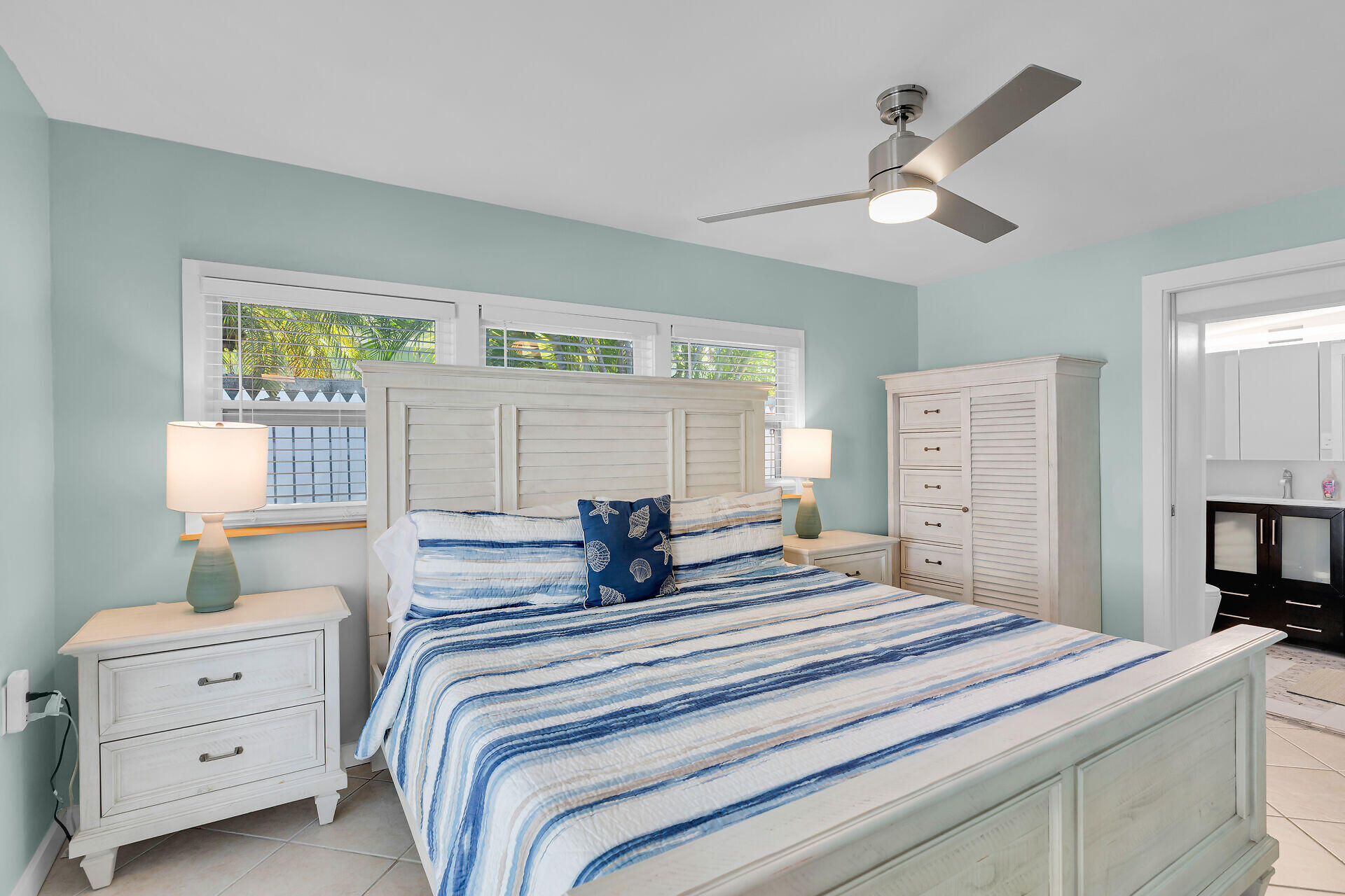1707 George Street Key West, FL 33040 - Photo 10 of 39 a bedroom with a bed and a dresser
