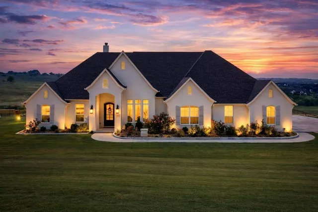 a front view of house with yard and green space
