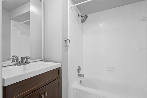 a bathroom with a sink and a bathtub