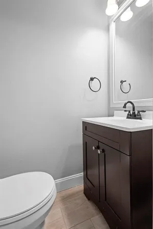 a bathroom with a sink toilet and vanity