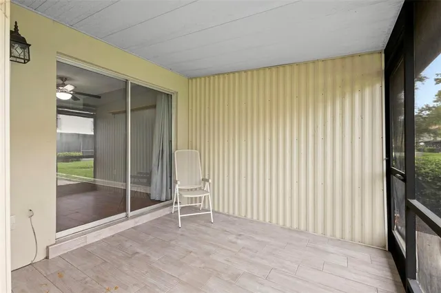 a view of an empty room with glass door