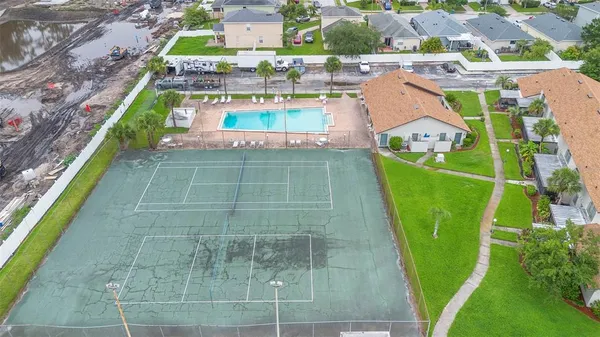 a view of a swimming pool with a outdoor seating