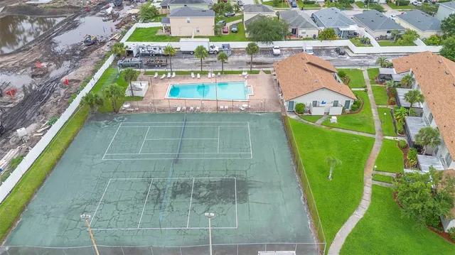 a view of a swimming pool with a outdoor seating