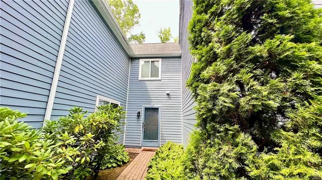 a view of a house with a flower garden