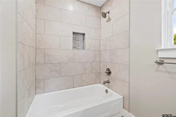 a bathroom with a bathtub