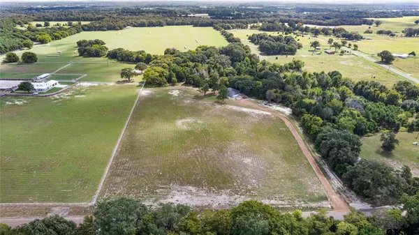 a view of a lake with a yard