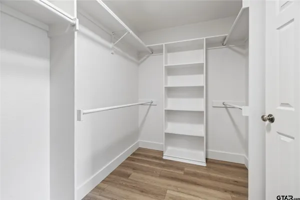 a view of an empty walk in closet