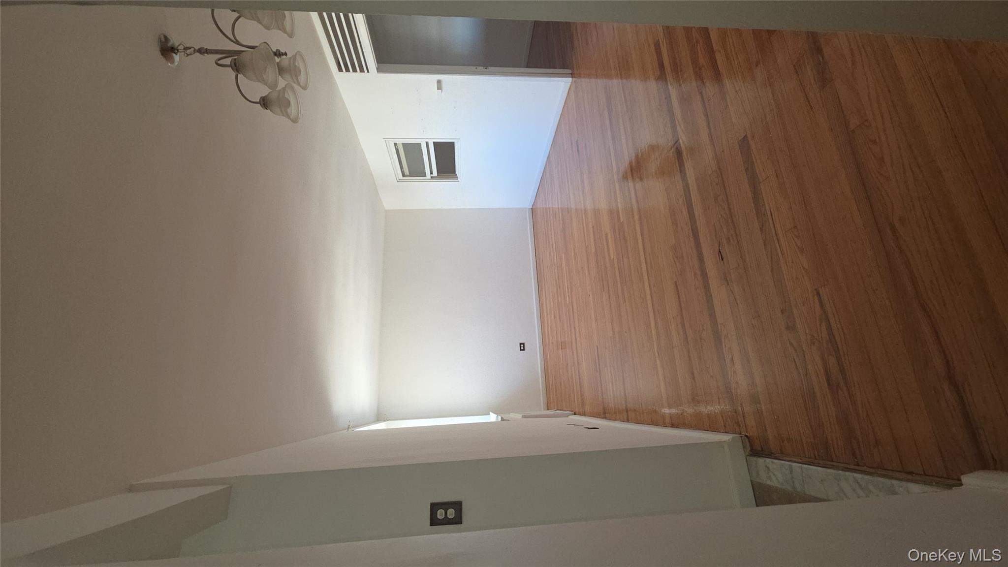 2640 Marion Avenue, Unit 6H Bronx, NY 10458 - Photo 11 of 14 a view of room and hardwood