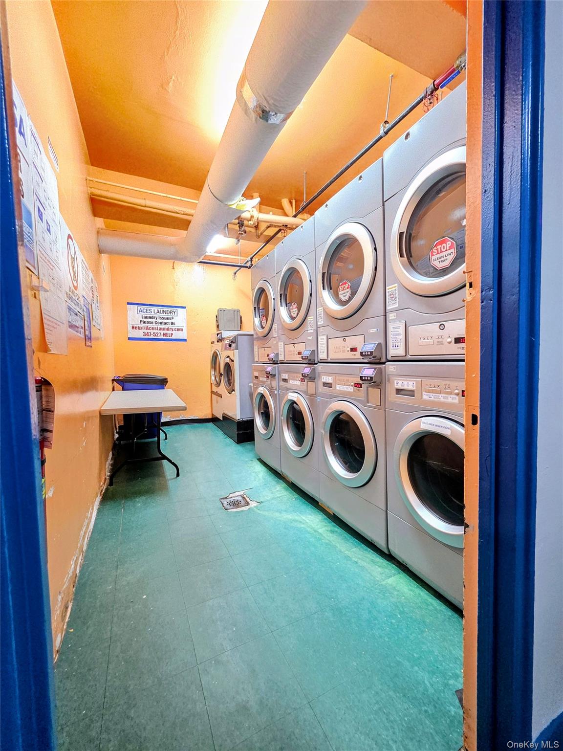 2640 Marion Avenue, Unit 6H Bronx, NY 10458 - Photo 14 of 14 a utility room with dryer and washer