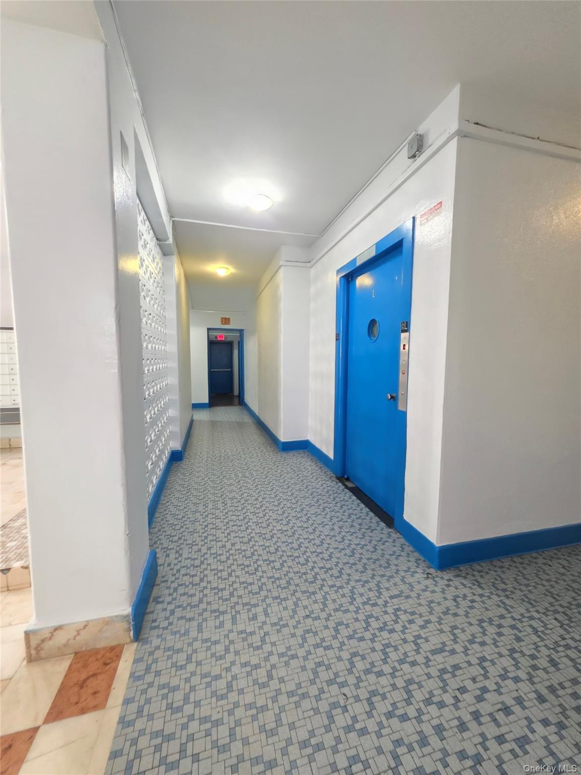 2640 Marion Avenue, Unit 6H Bronx, NY 10458 - Photo 3 of 14 a view of a hallway with wooden floor
