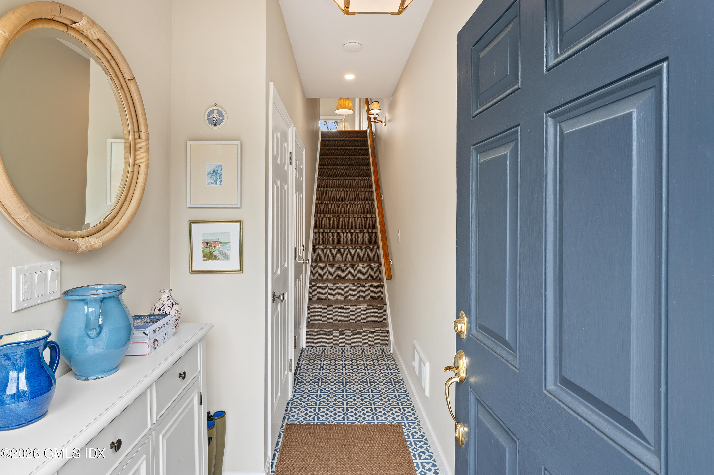 115 River Road, Unit 3 Cos Cob, CT 06807 - Photo 8 of 40 a view of a hallway to rooms and stairs