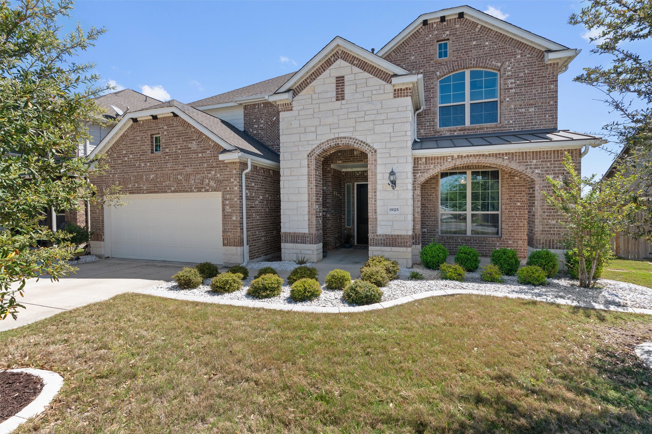 19325 Stembridge Run Pflugerville, TX 78660 - Photo 1 of 38 a front view of a house with a yard