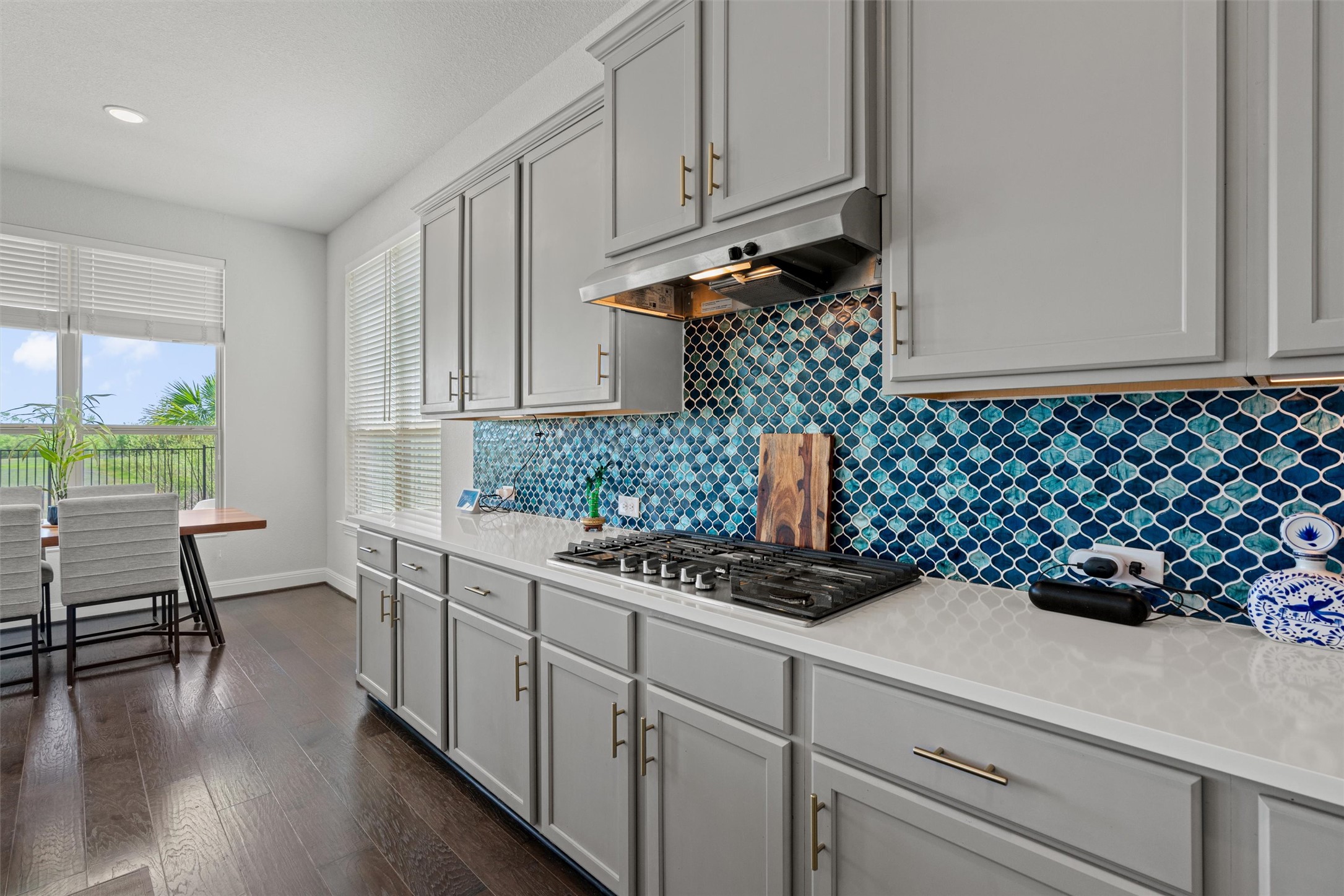 19325 Stembridge Run Pflugerville, TX 78660 - Photo 10 of 38 a kitchen with a sink a stove and white cabinets