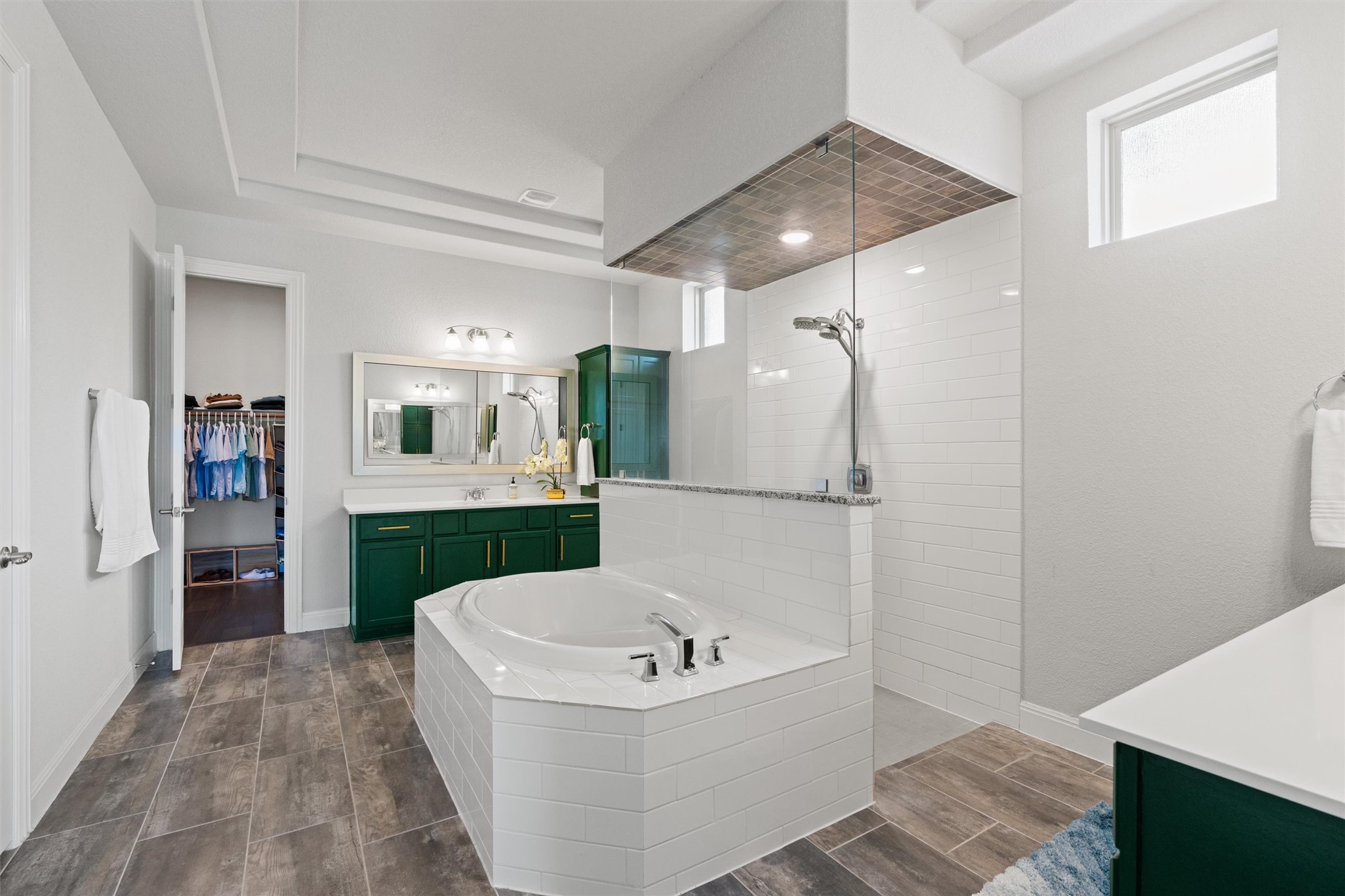 19325 Stembridge Run Pflugerville, TX 78660 - Photo 13 of 38 a bathroom with a bathtub and a shower