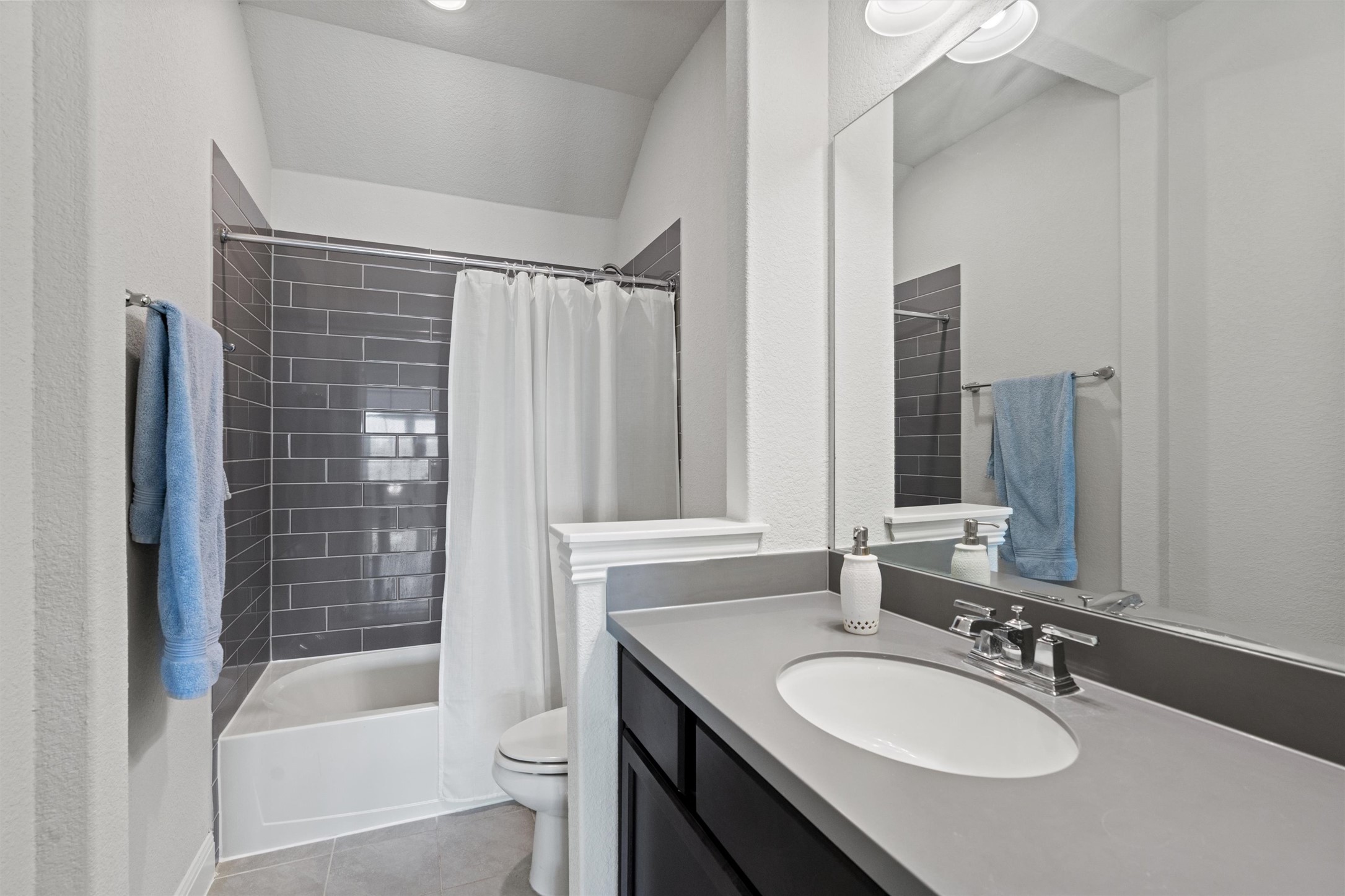 19325 Stembridge Run Pflugerville, TX 78660 - Photo 22 of 38 a bathroom with a granite countertop sink toilet and shower