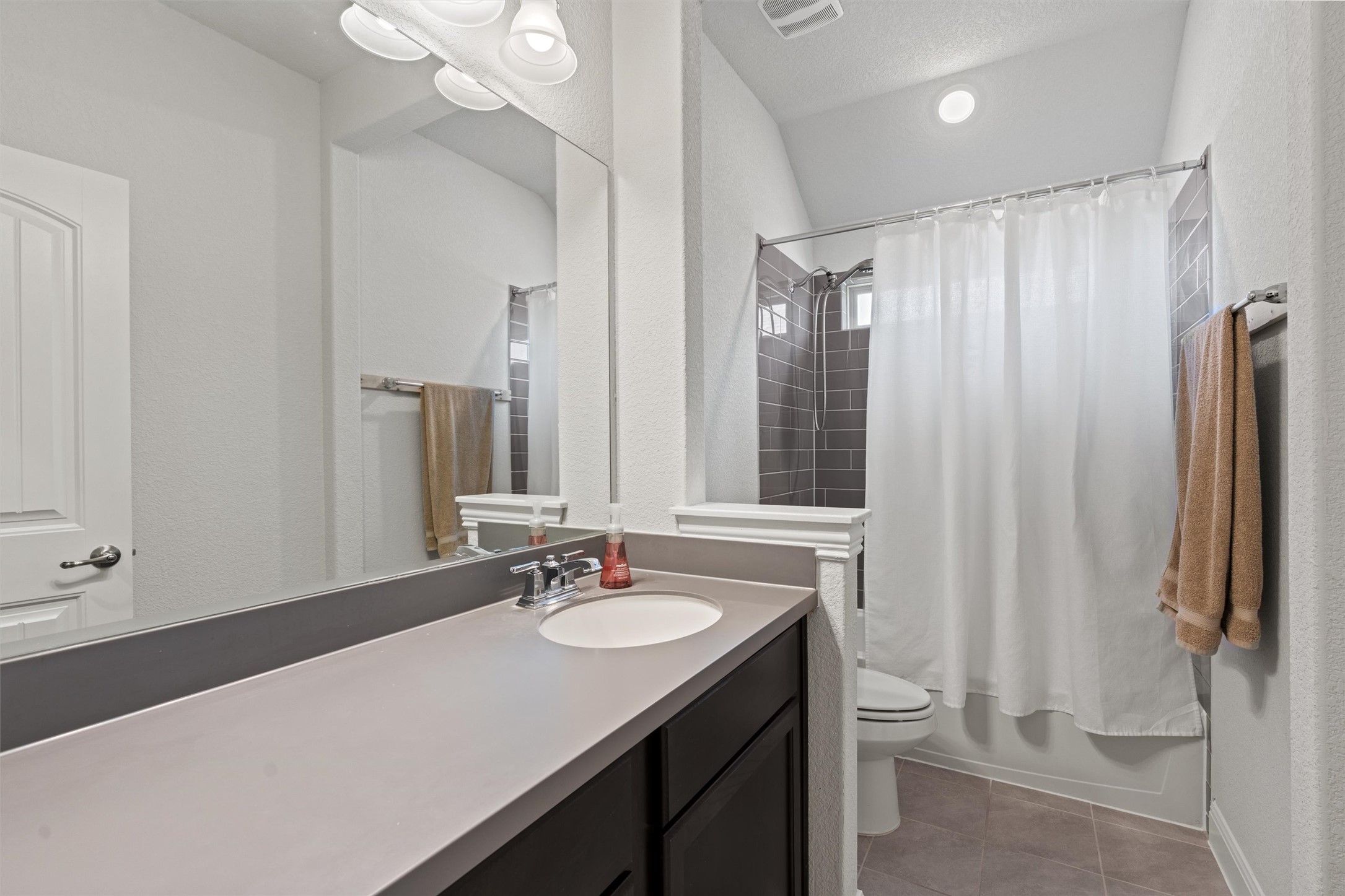 19325 Stembridge Run Pflugerville, TX 78660 - Photo 27 of 38 a bathroom with a sink vanity granite and toilet