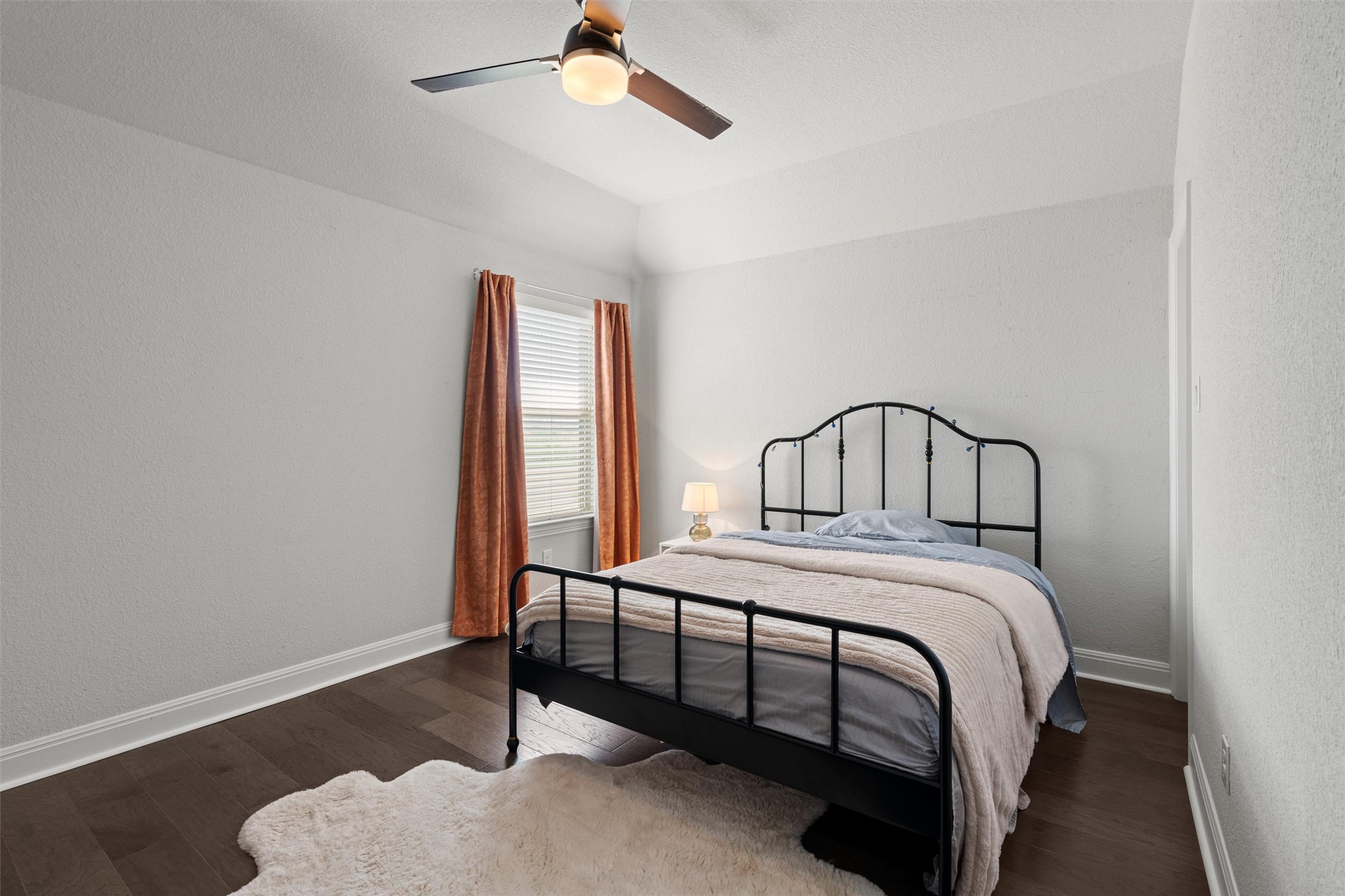 19325 Stembridge Run Pflugerville, TX 78660 - Photo 28 of 38 a bedroom with a bed a chandelier and dresser