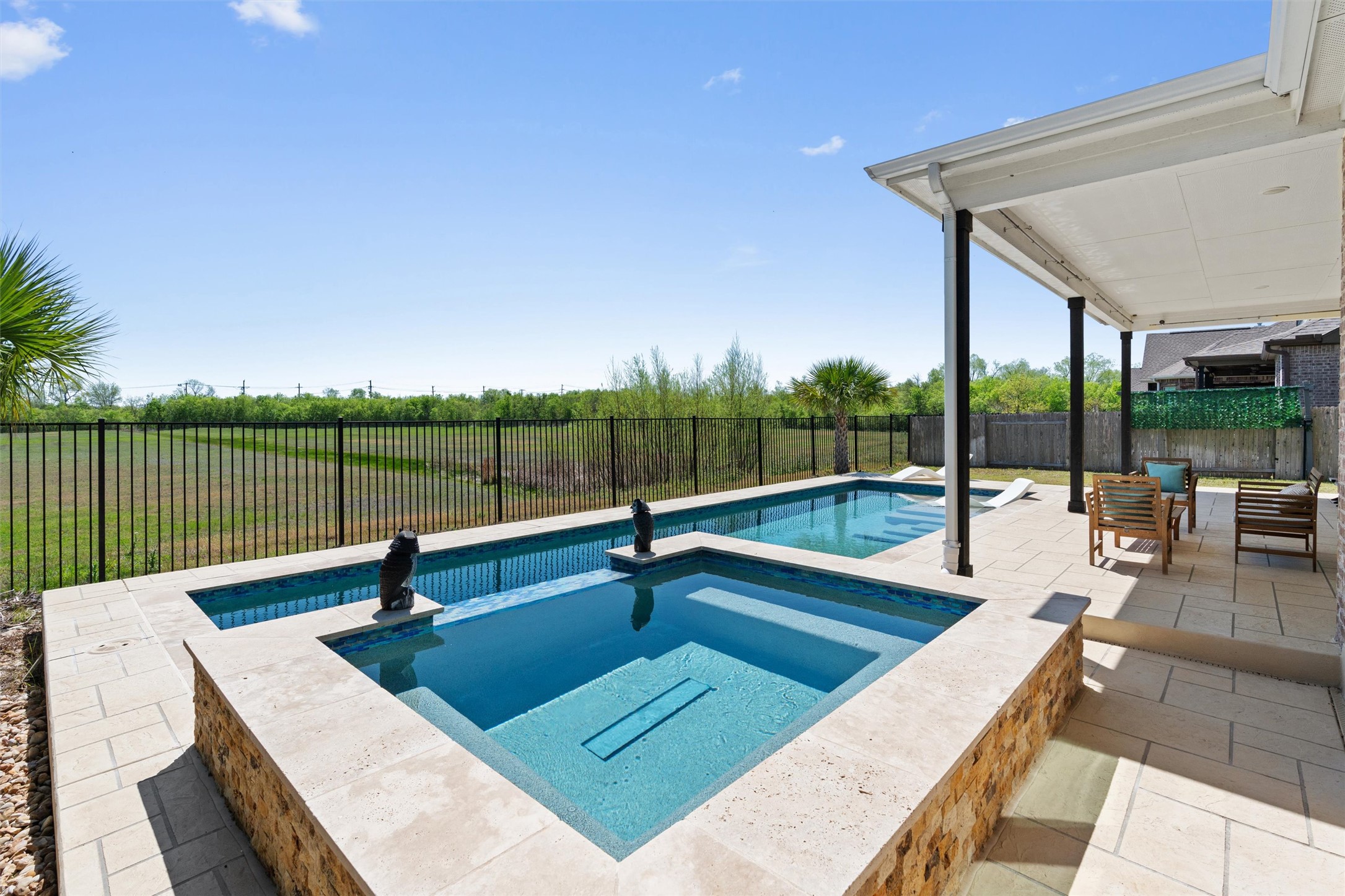 19325 Stembridge Run Pflugerville, TX 78660 - Photo 31 of 38 Combined pool / hot tub with a patio area and a fenced backyard