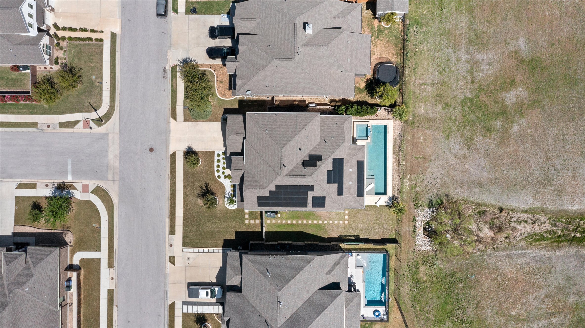 19325 Stembridge Run Pflugerville, TX 78660 - Photo 35 of 38 Aerial perspective of suburban area featuring a pool area