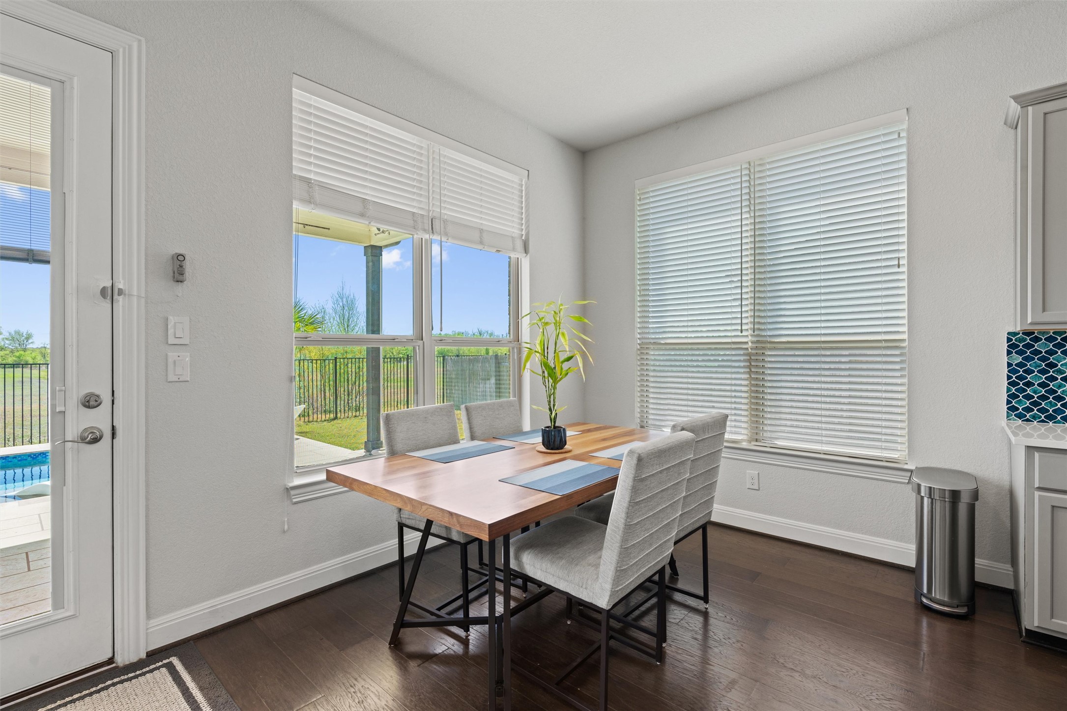 19325 Stembridge Run Pflugerville, TX 78660 - Photo 6 of 38 a view of a dining room with furniture window and wooden floor
