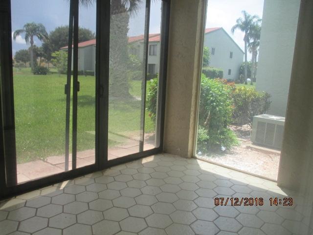 5423 Southeast Miles Grant Road, Unit F103 Stuart, FL 34997 - Photo 12 of 13 Patio