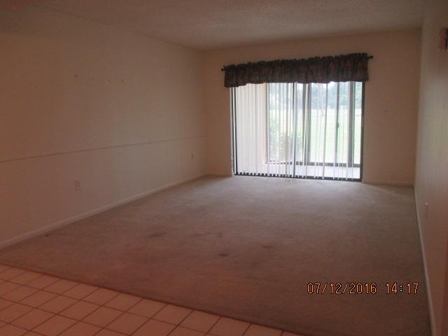 5423 Southeast Miles Grant Road, Unit F103 Stuart, FL 34997 - Photo 8 of 13 Living room