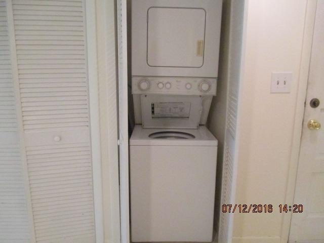 5423 Southeast Miles Grant Road, Unit F103 Stuart, FL 34997 - Photo 10 of 13 Laundry Closet