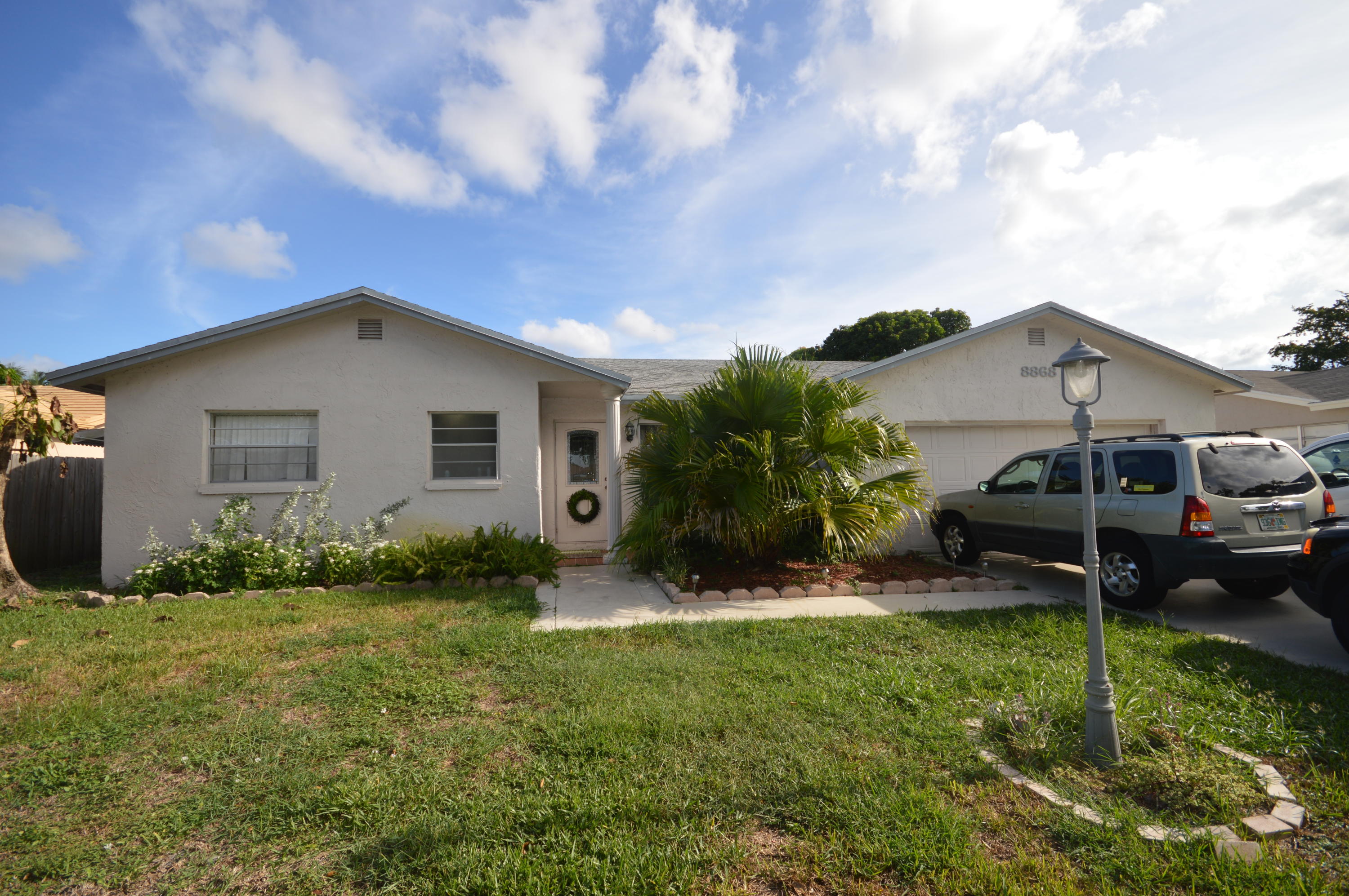 8868 Southwest 8th Street Boca Raton, FL 33433 - Photo 1 of 16 Exterior Front