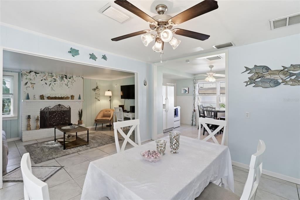 14235 Clamshell Lane Hudson, FL 34667 - Photo 11 of 25 a view of a dining room with furniture and chandelier