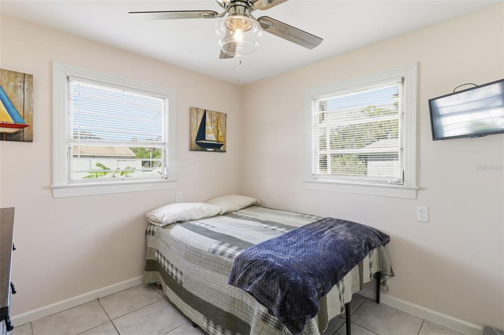 14235 Clamshell Lane Hudson, FL 34667 - Photo 17 of 25 a bedroom with a bed and a window