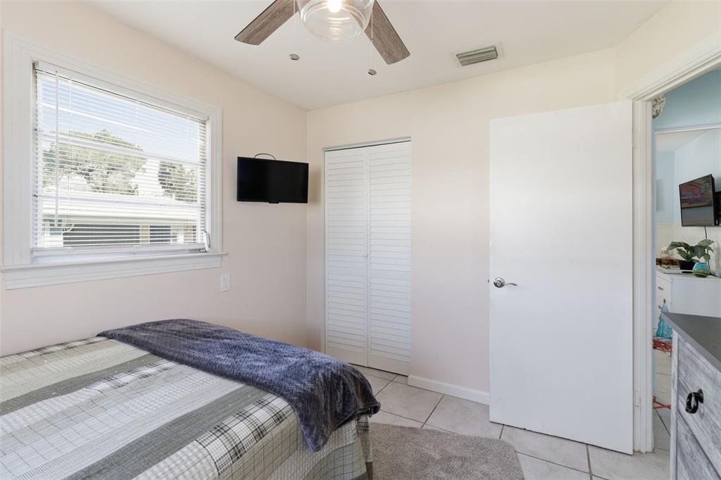 14235 Clamshell Lane Hudson, FL 34667 - Photo 18 of 25 a bedroom with a bed and a window