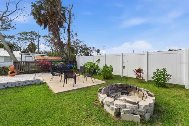 a view of a backyard with a garden and plants