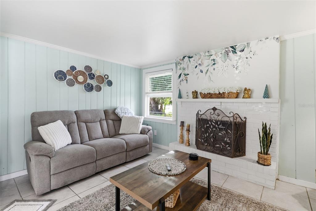 14235 Clamshell Lane Hudson, FL 34667 - Photo 8 of 25 a living room with furniture and a fireplace