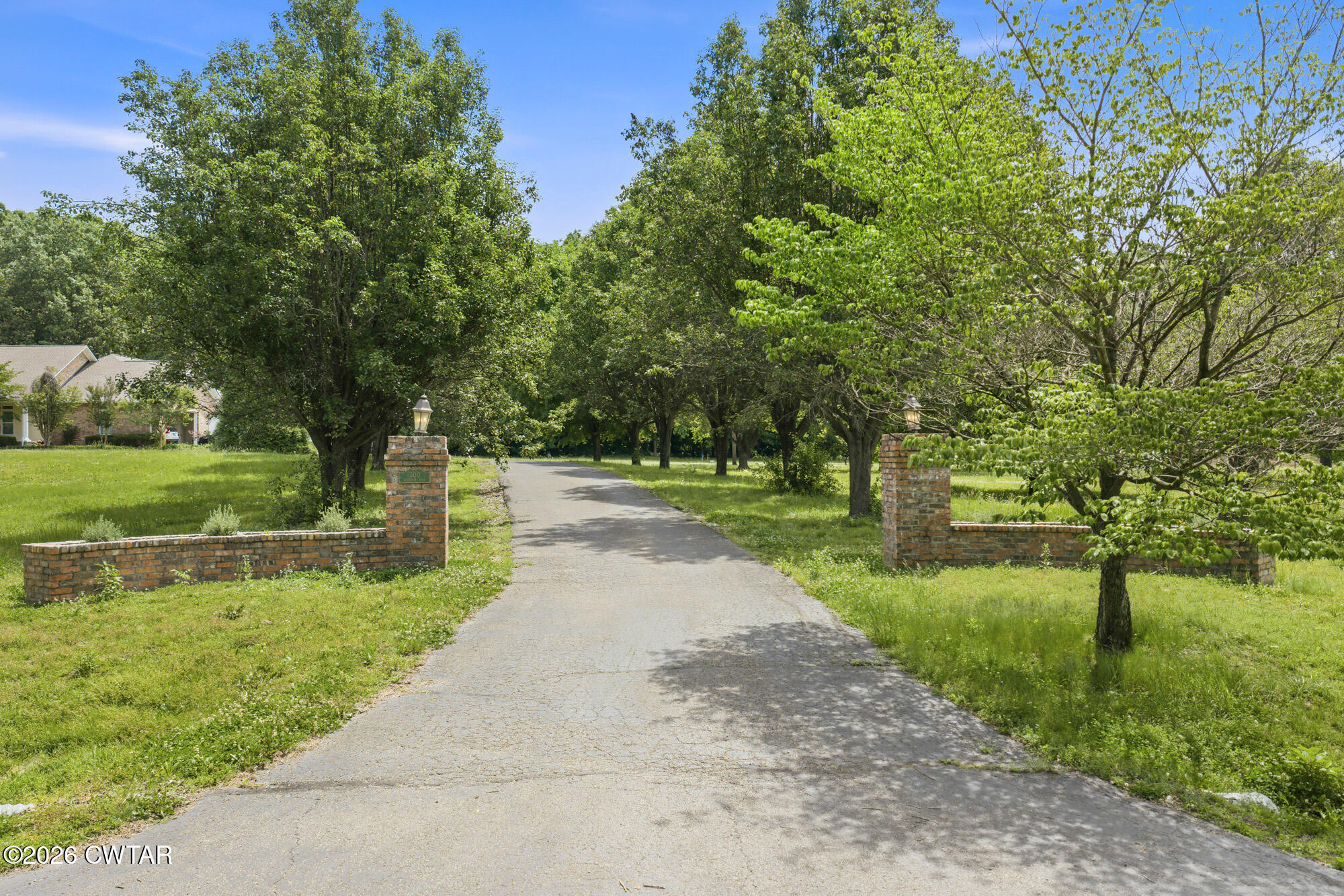 300 Harrison Road Dyersburg, TN 38024 - Photo 1 of 27 a park view with large trees