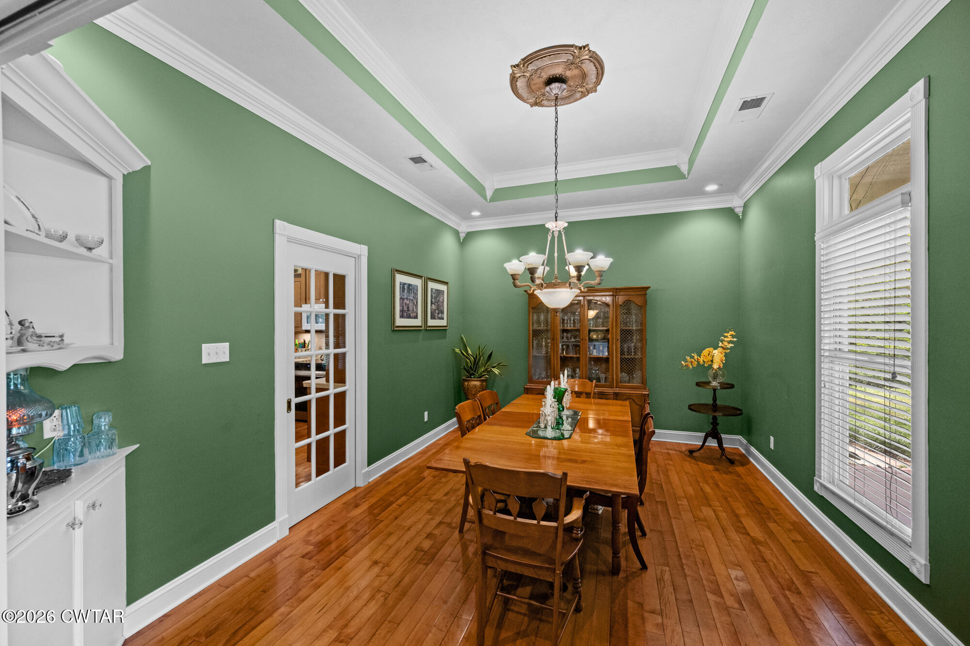 300 Harrison Road Dyersburg, TN 38024 - Photo 12 of 27 a dining room with furniture a chandelier and wooden floor