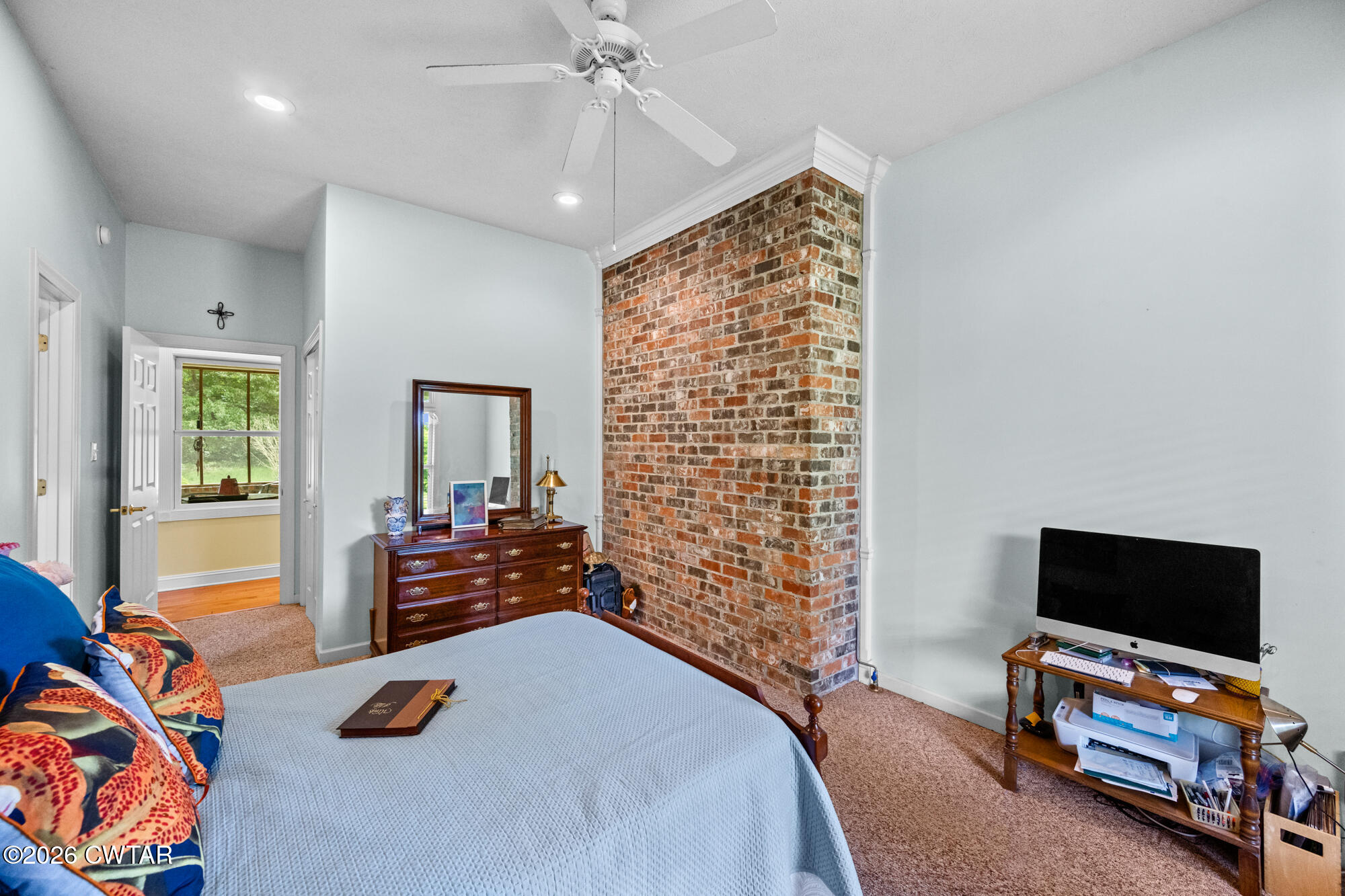 300 Harrison Road Dyersburg, TN 38024 - Photo 20 of 27 a bedroom with furniture and a flat screen tv