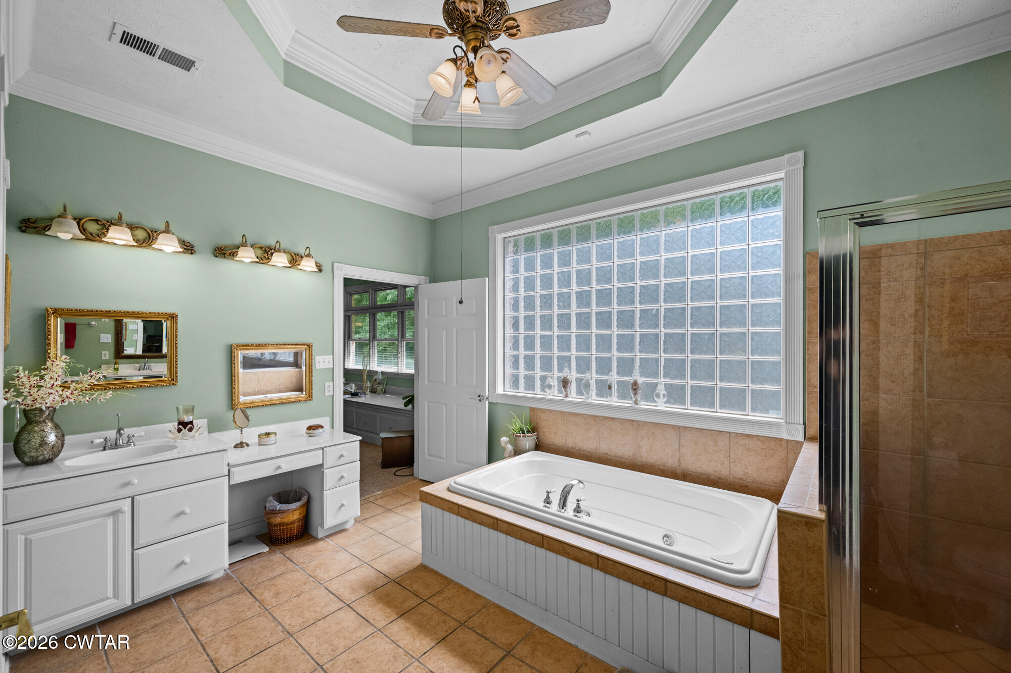 300 Harrison Road Dyersburg, TN 38024 - Photo 21 of 27 a bathroom with a tub sink and mirror