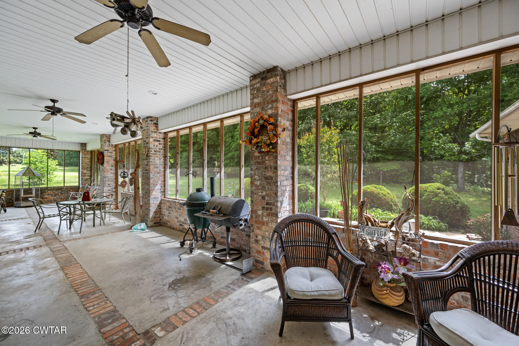 300 Harrison Road Dyersburg, TN 38024 - Photo 25 of 27 a living room with furniture and floor to ceiling windows