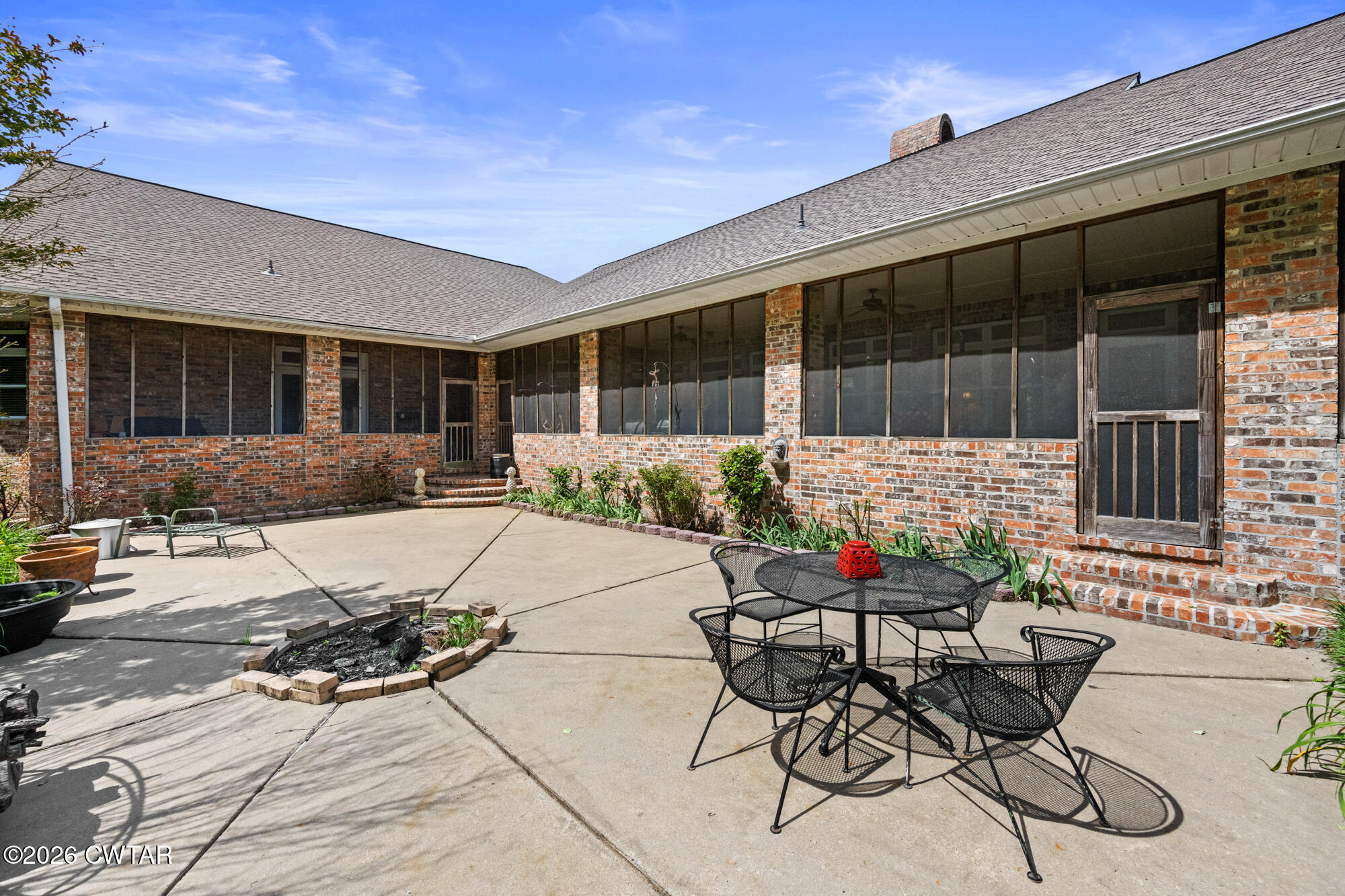 300 Harrison Road Dyersburg, TN 38024 - Photo 26 of 27 a backyard of a house with table and chairs