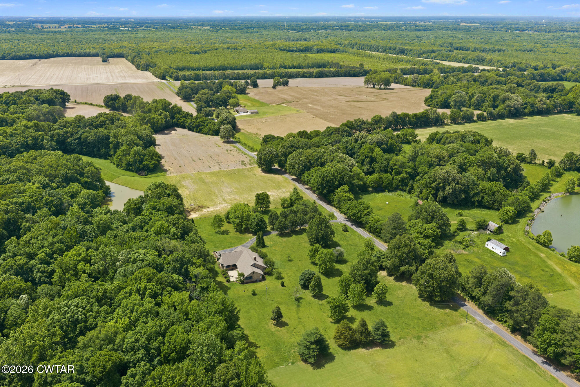 300 Harrison Road Dyersburg, TN 38024 - Photo 5 of 27 a view of a lake with a houses