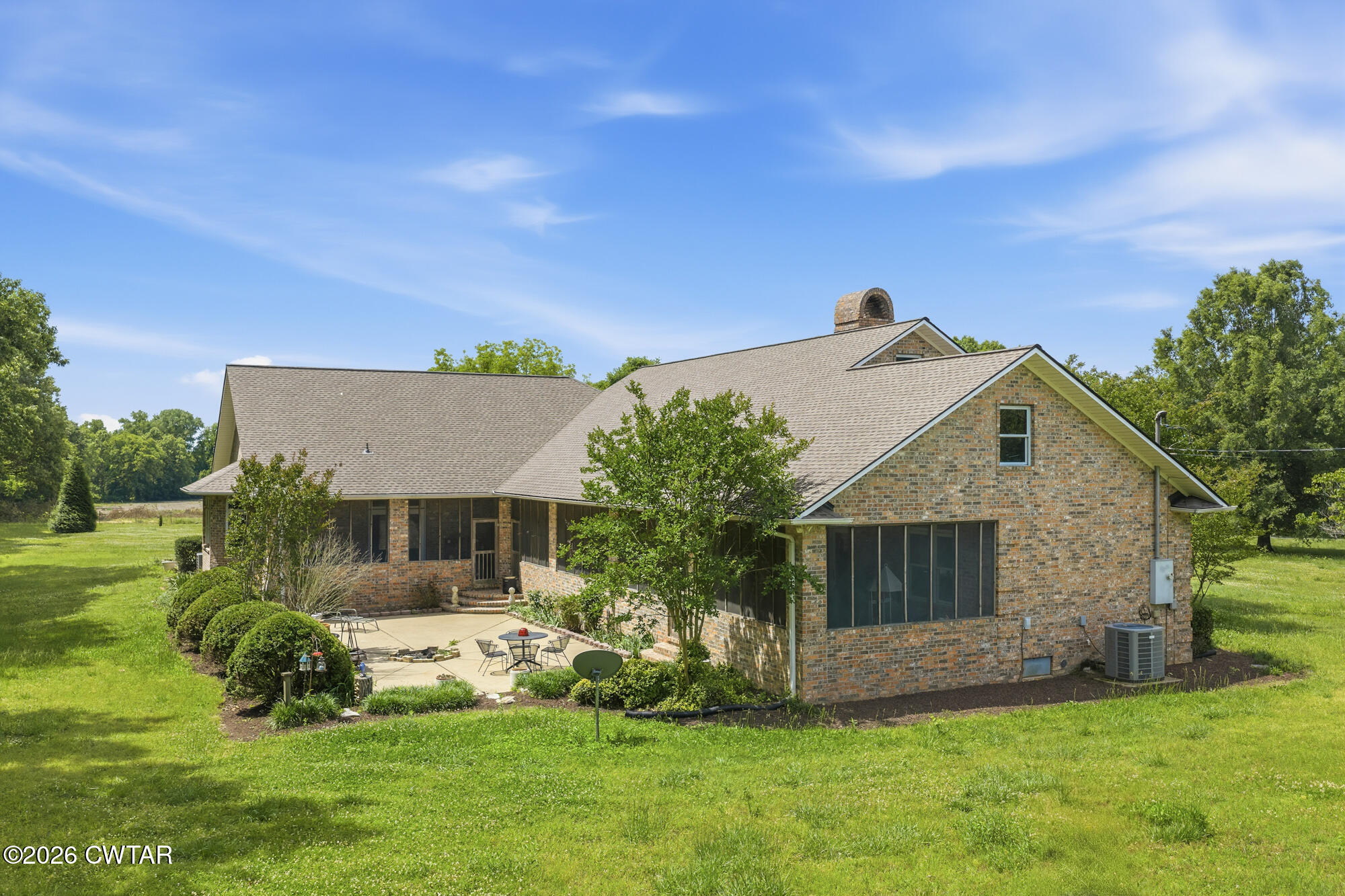 300 Harrison Road Dyersburg, TN 38024 - Photo 7 of 27 a front view of a house with a yard