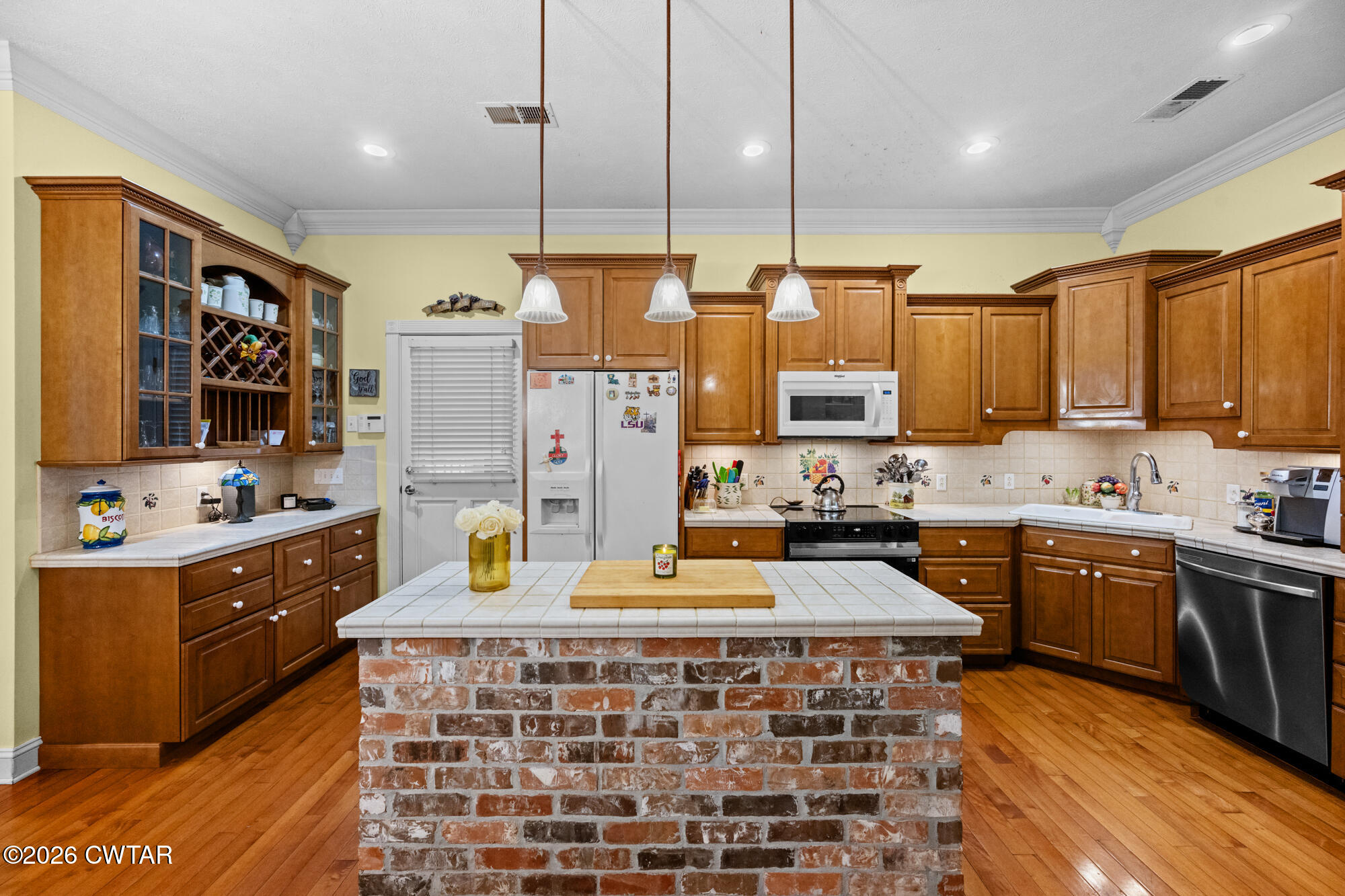 300 Harrison Road Dyersburg, TN 38024 - Photo 8 of 27 a kitchen with kitchen island granite countertop a sink stove and cabinets
