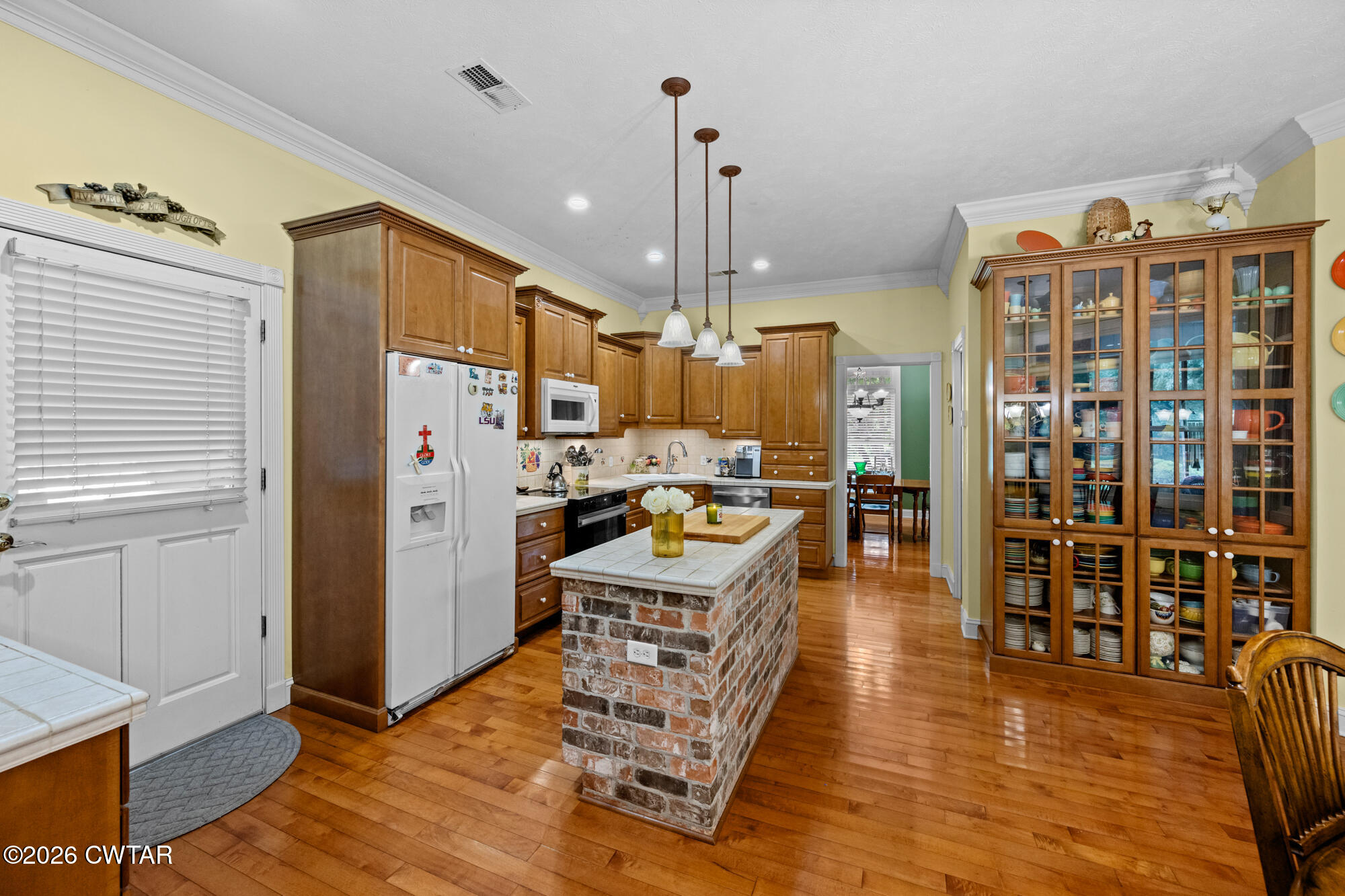 300 Harrison Road Dyersburg, TN 38024 - Photo 9 of 27 a view of a kitchen with furniture and wooden floor