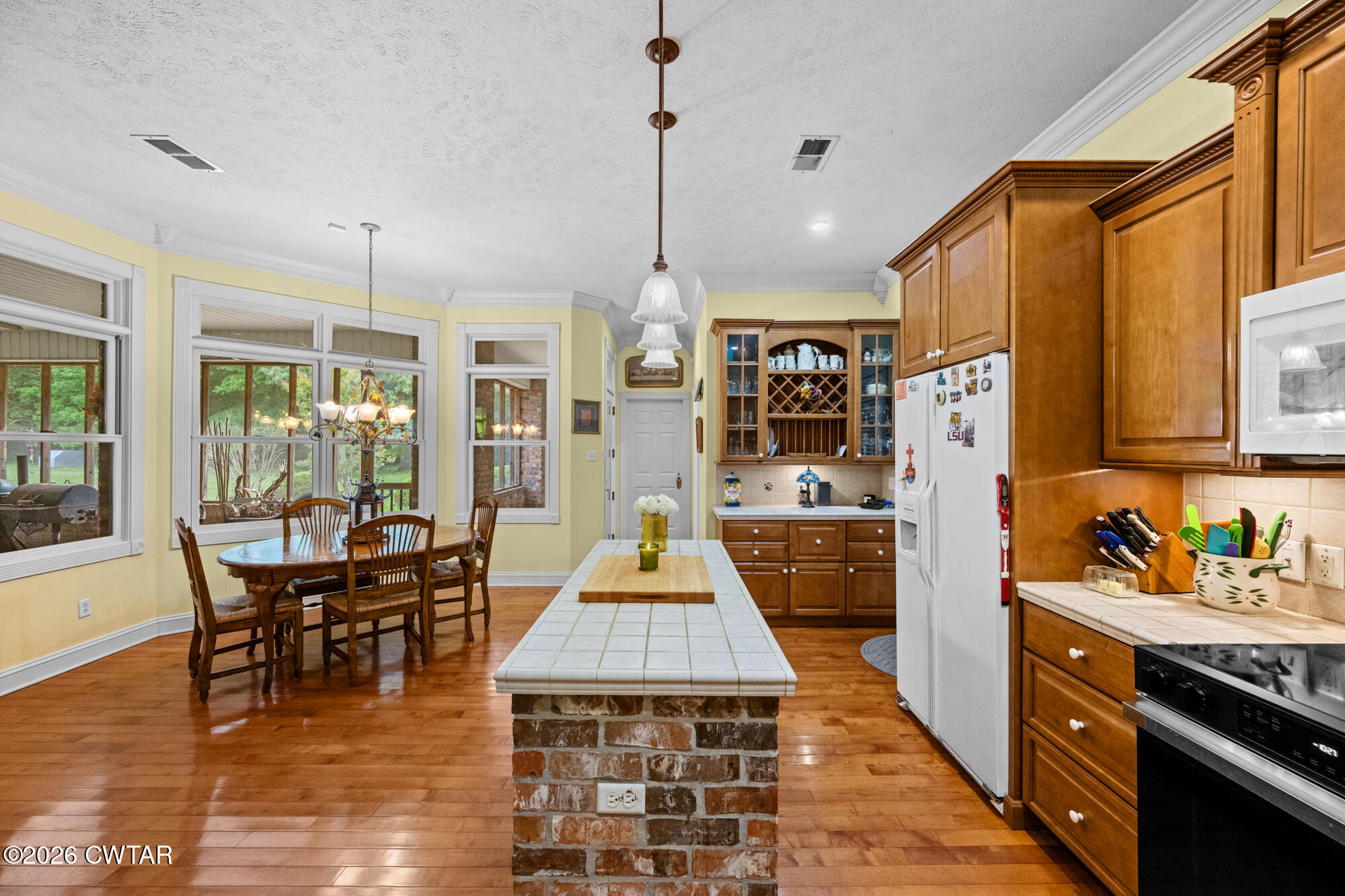 300 Harrison Road Dyersburg, TN 38024 - Photo 10 of 27 a large kitchen with lots of counter space and dining table