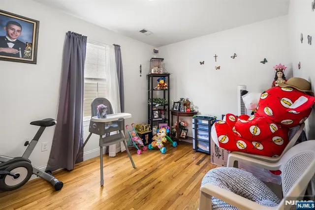 a room with furniture and wooden floor